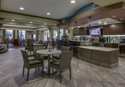 Bright common area with seating and bar