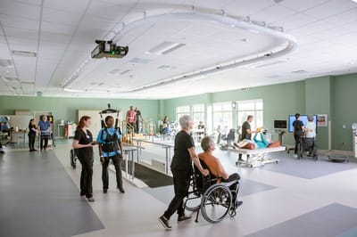 Patients and staff engaging in a therapy session