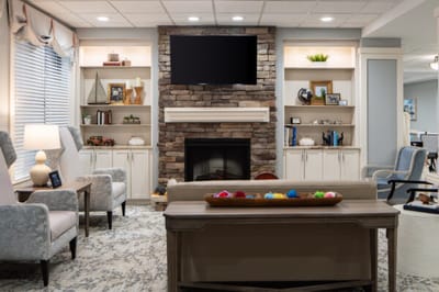 A cozy common area with seating and a fireplace