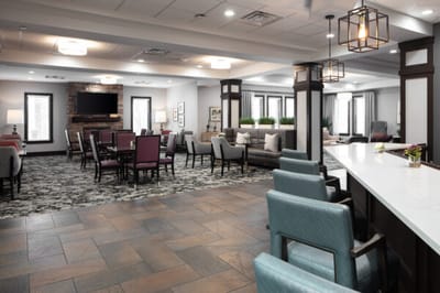 Common area in a senior living community with seating and decor