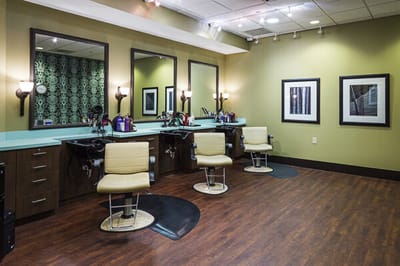 Interior view of a hair salon with styling stations