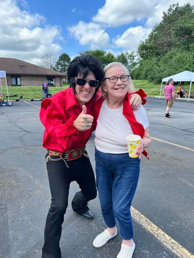 Resident enjoying an Elvis performance with entertainer