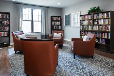 Cozy common area with bookshelves and seating