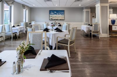 Dining area with tables set for a meal