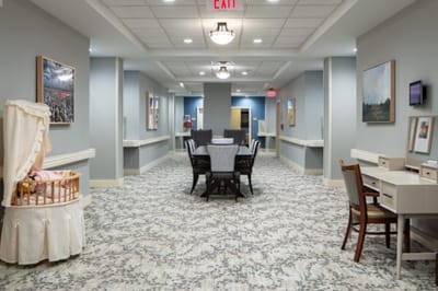 Bright corridor with seating and artwork on the walls