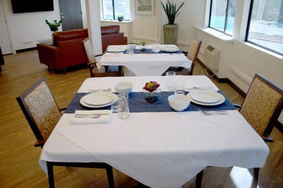 Dining area set with plates and glasses
