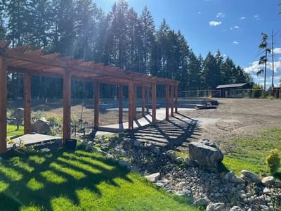 Outdoor space with wooden structure and landscaping