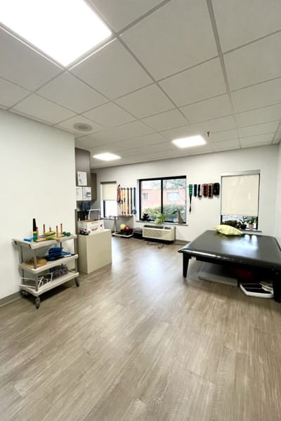Interior view of a rehabilitation therapy area with equipment