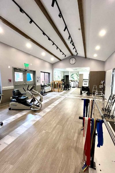 Interior view of a rehabilitation room with exercise equipment