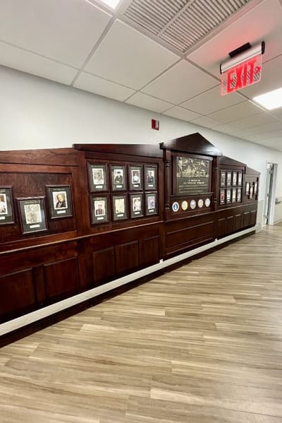 Gallery wall with resident photos and plaques