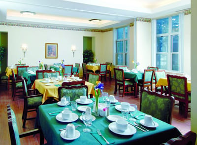 Dining area with tables set for a meal