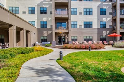 Pathway and outdoor seating area at a senior living facility