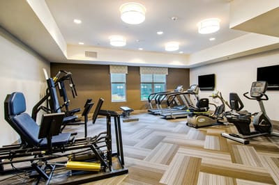 Fitness room with exercise equipment and machines
