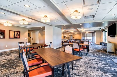 Bright common area with tables and chairs