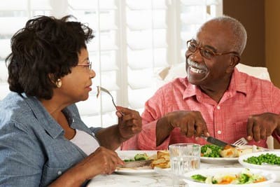 Older couple enjoying a meal in a dining area