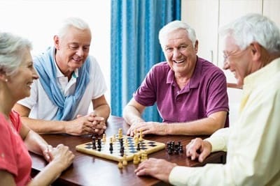 Seniors enjoying a game of chess together