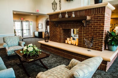 Cozy lounge area with fireplace and seating