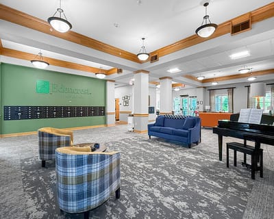Common area with seating and piano in Edencrest