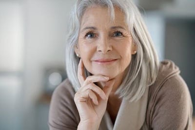 Smiling senior woman with grey hair