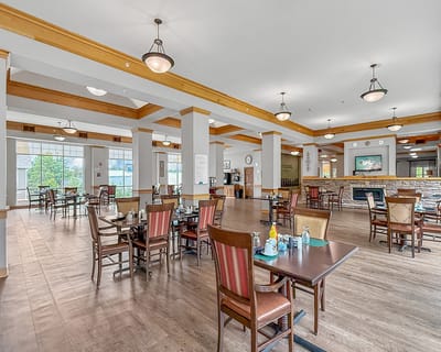 Bright dining area with tables and chairs