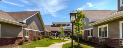 Well-maintained pathways and gardens in a senior living facility