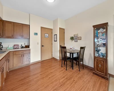 Cozy kitchen and dining area in a resident's room