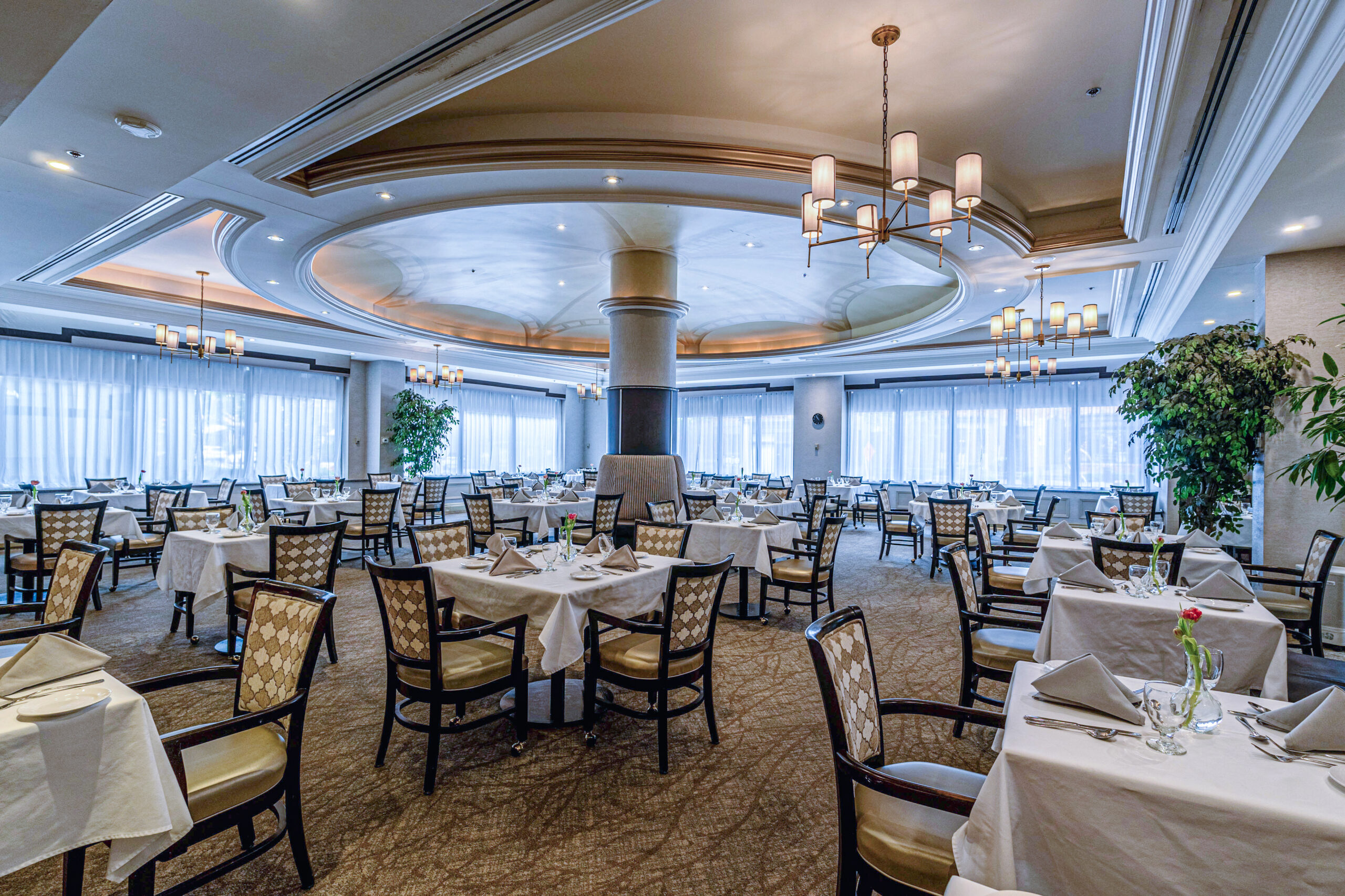Elegant dining room with tables set for meals