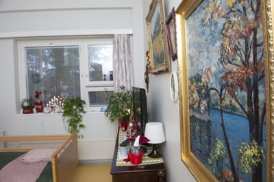 Cozy interior of a resident's room with artwork