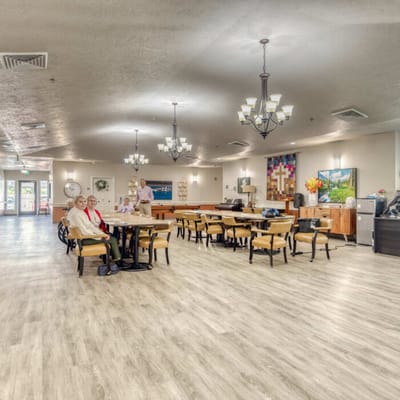 Bright common area with residents and staff