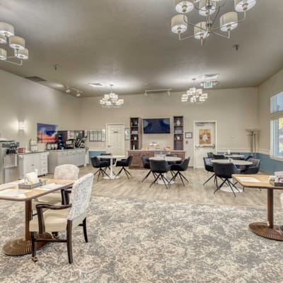 Bright common area with tables and chairs