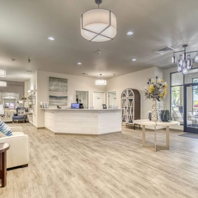 Bright common area with modern decor and reception desk