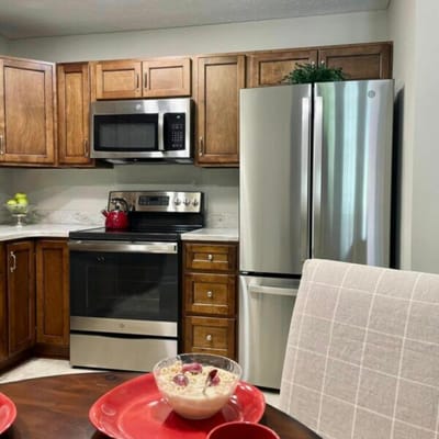 Well-equipped kitchen with modern appliances and breakfast set