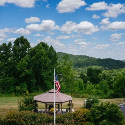 Outdoor gazebo with American flag and scenic view
