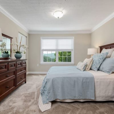 Cozy private resident room with a bed and window