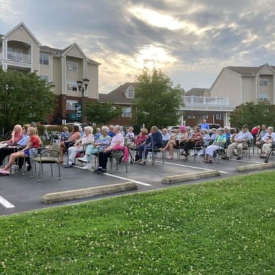 Residents enjoying an outdoor event in a courtyard