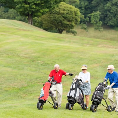 Residents enjoying a day of golfing outdoors
