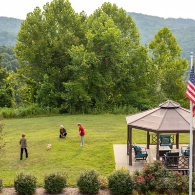 Residents enjoying an outdoor space with a gazebo