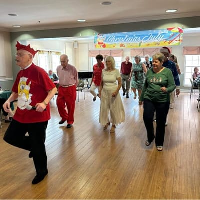Residents dancing happily during an activity