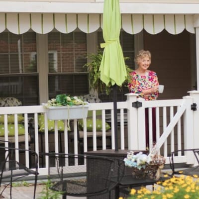Resident enjoying the outdoor space on the patio