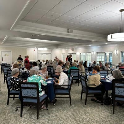 Residents enjoying dinner in a dining room