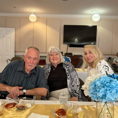 Three residents enjoying time together in a common area