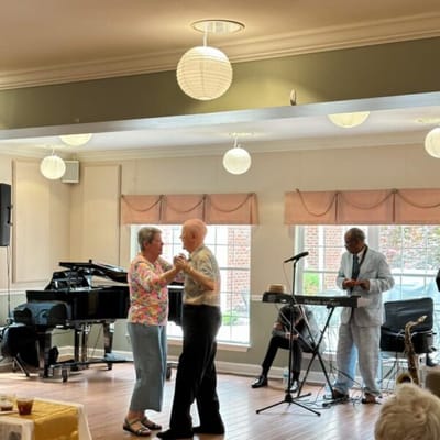 Residents dancing during a community event in a common area