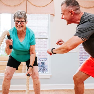 Residents engaging in a fitness activity with ropes