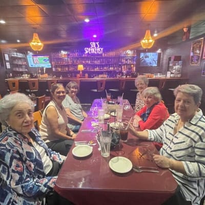 Residents enjoying a meal at a social gathering