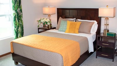 Cozy private bedroom with bed and lamps