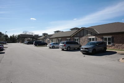 Exterior view of The Willows at Springhurst with parking area