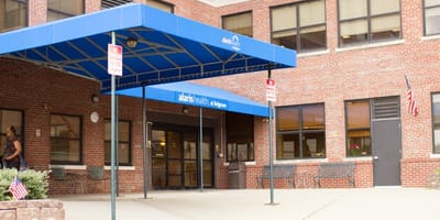 Entrance of Alaris Health at Belgrove facility with awning