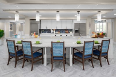 Bright dining area with a modern kitchen and seating