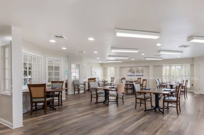Bright dining room with wooden tables and chairs