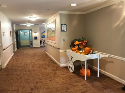 Interior hallway decorated for fall with pumpkins
